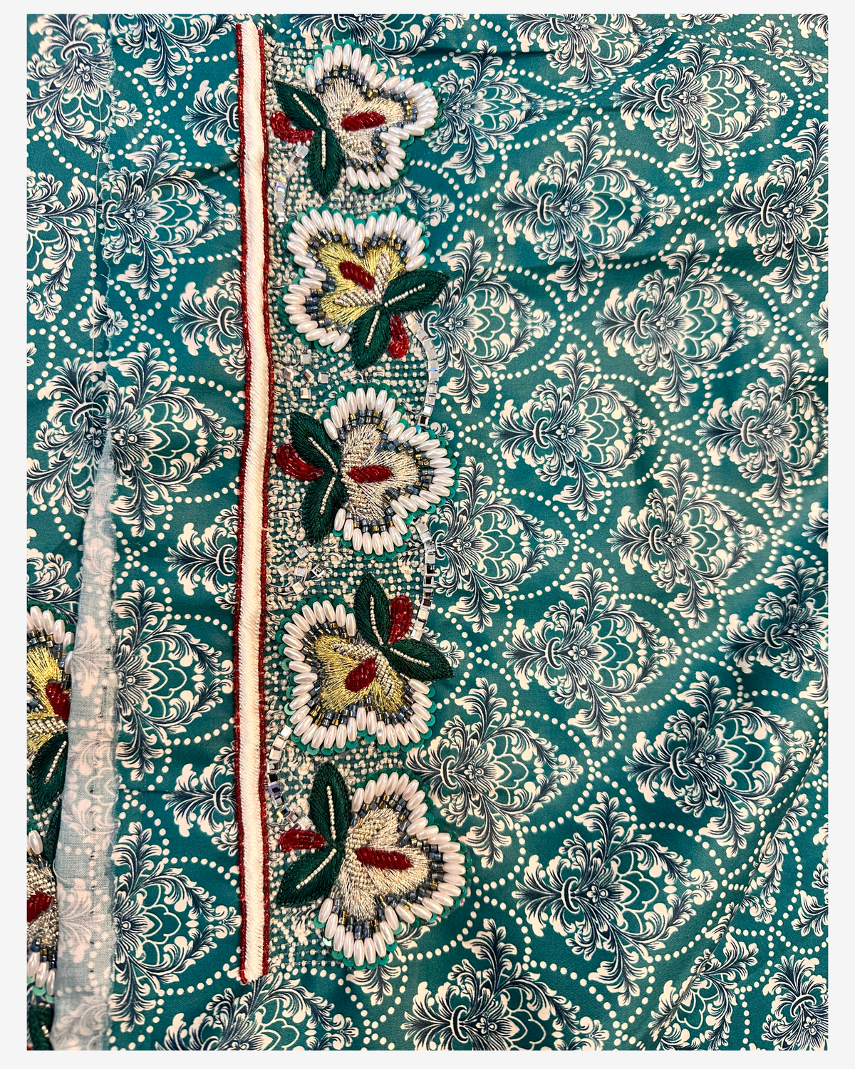 Matching hand design with pearl-style floral beadwork on teal ornamental Japanese Liberty cotton fabric.