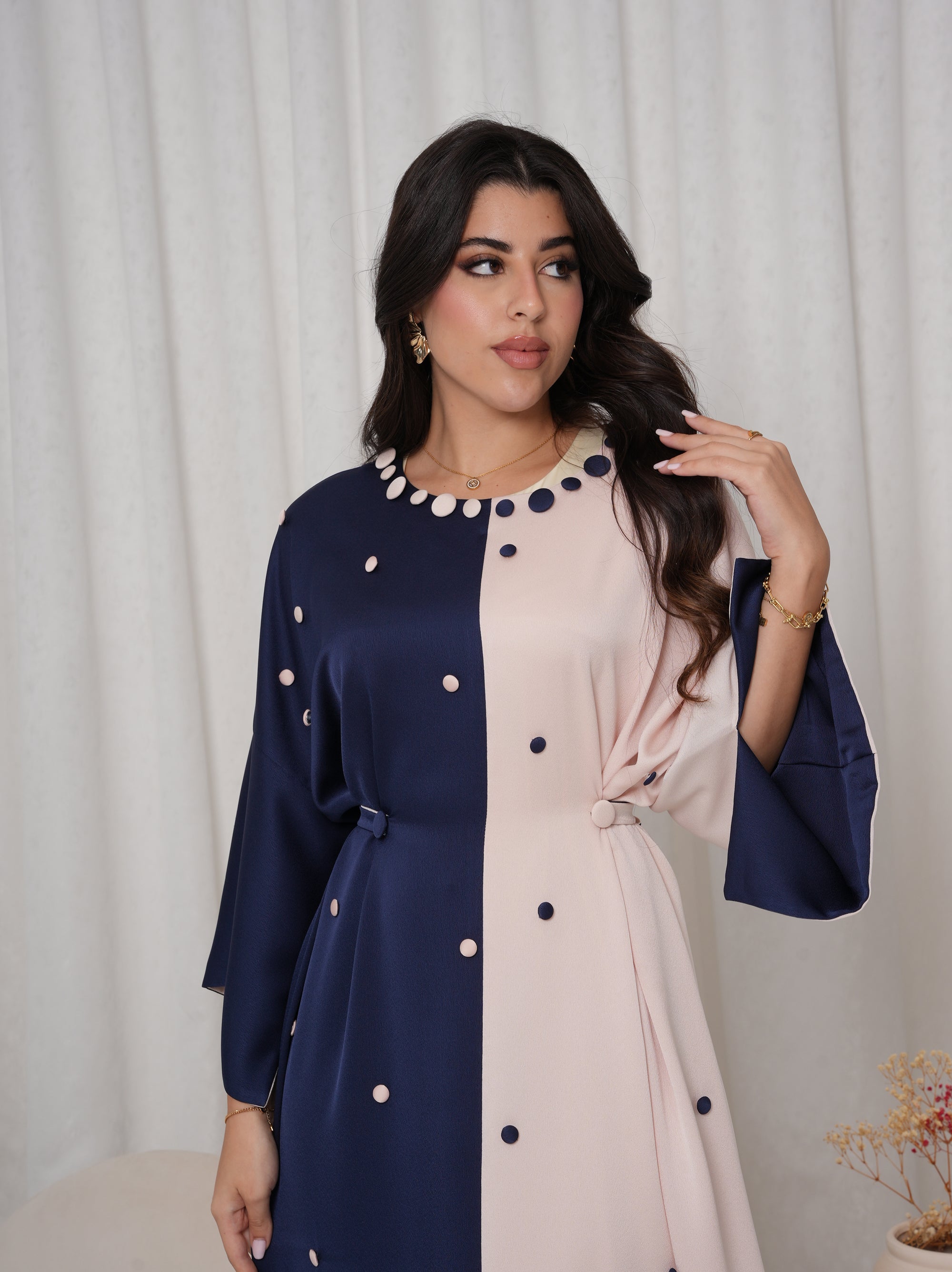 Close-up of the Two-Tone Button Embellished Crepe Kaftan featuring the embellished round neckline and premium crepe fabric.