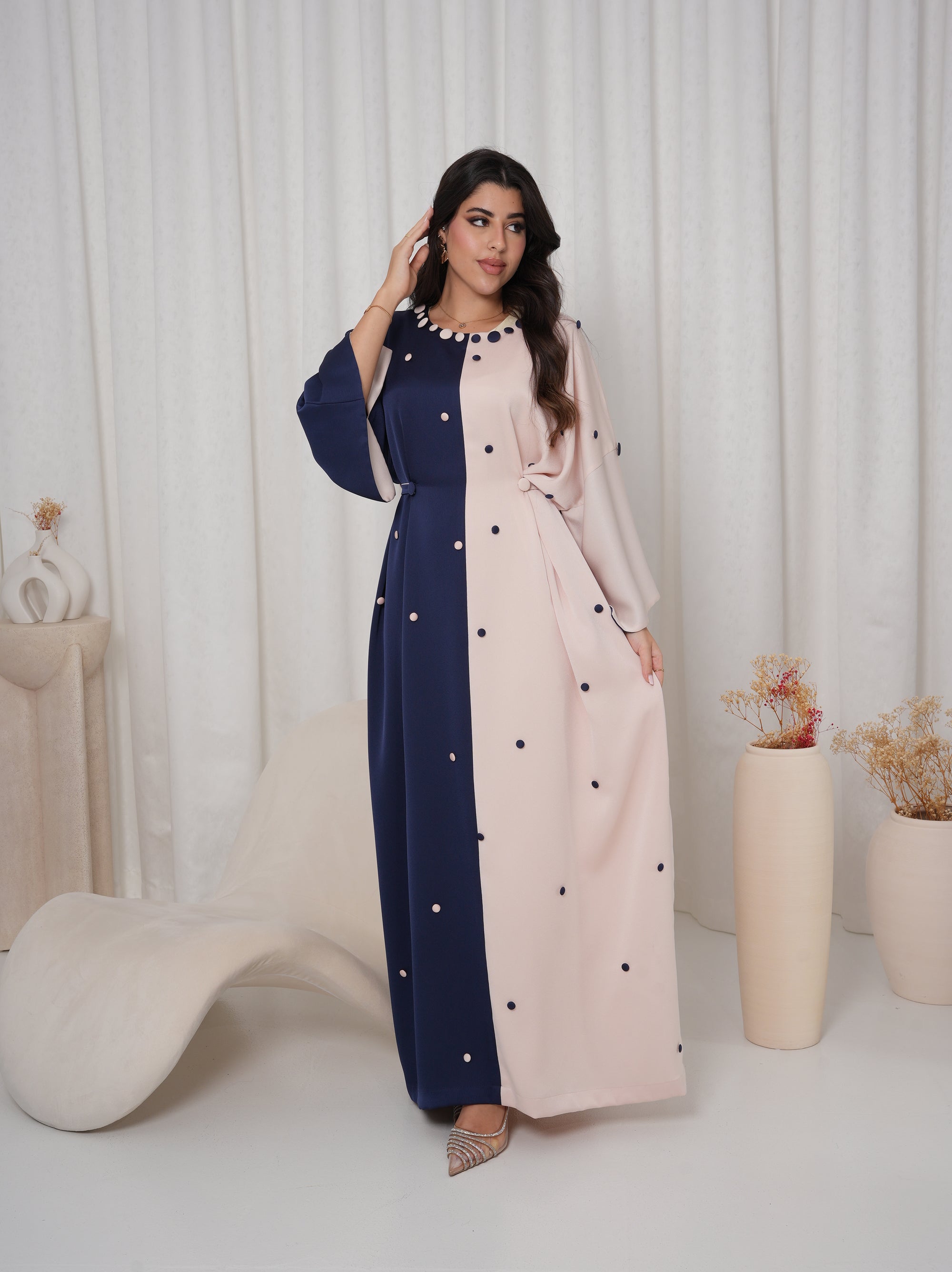 Side view of the Two-Tone Button Embellished Crepe Kaftan highlighting the elegant drape and adjustable waist detail.