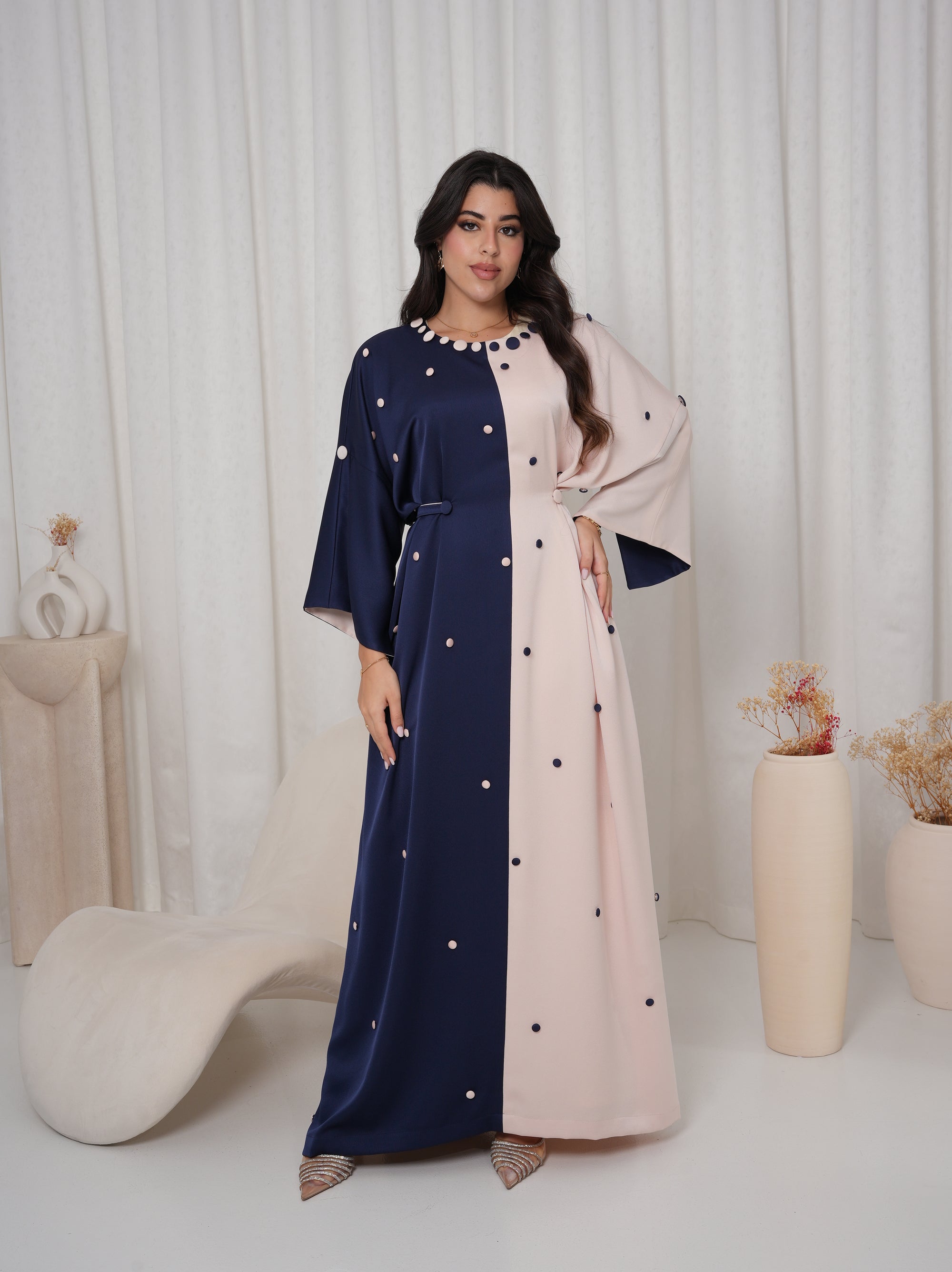 Lifestyle view of the Two-Tone Button Embellished Crepe Kaftan by Gharza Couture styled for Ramadan, Eid, and special occasions.