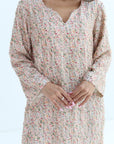 Floral dress with long sleeves on a white background