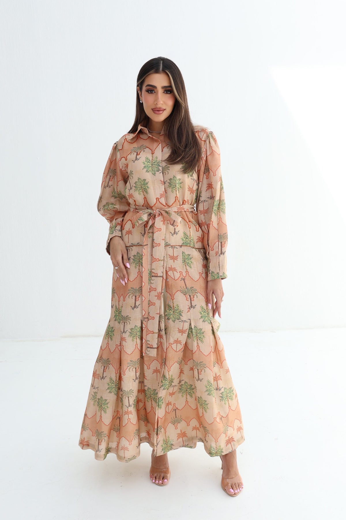 Full-length Desert Palm Pleated Linen Blend Dress with soft peach botanical print