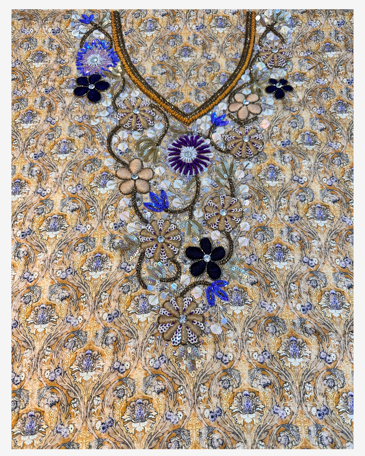 Front neckline of the Golden Nocturne gold paisley mukhawar with navy, purple and silver hand-beaded flowers.