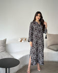 Full-length view of the Layla Noir Jalabiya in black geometric print fabric