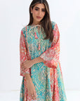 Woman wearing a colorful patterned dress on a white background