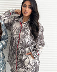 Close-up of the tropical palm print detail on the Palm Royale Travel Wear Set.