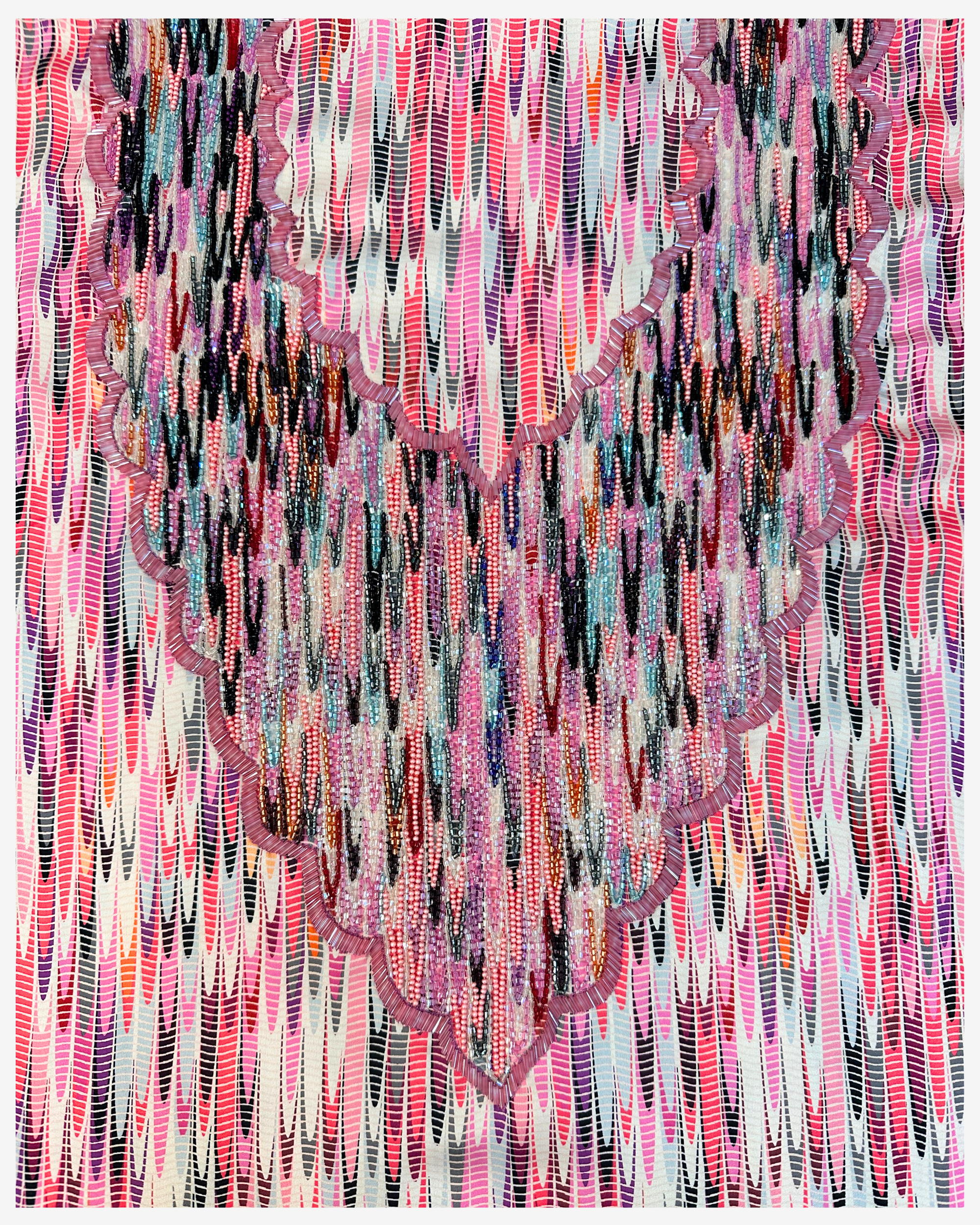 Close-up of Rose Prism jacquard silk fabric with pink black aqua and silver hand beadwork