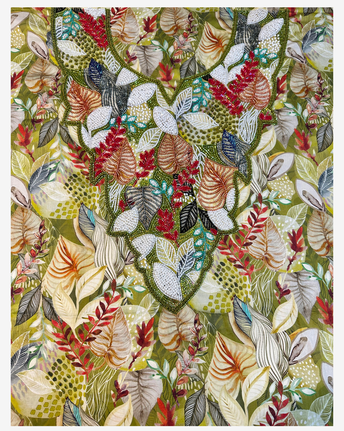 Close-up of the hand-beaded botanical neckline on the Tropical Canopy cotton mukhawar fabric.