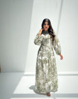 Women's botanical print linen blend jalabiya with long sleeves and elegant modest silhouette front view