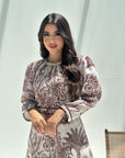 Close-up of botanical print linen blend fabric with contrast piping detail on luxury women's jalabiya