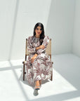Detailed view of botanical print and contrast trim on modest linen blend jalabiya for women