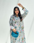 Close-up detail of colorful wildflower botanical print on luxury linen blend jalabiya for women