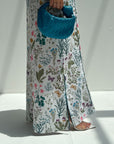 Classic collar and contrast piping detail on wildflower print linen blend jalabiya