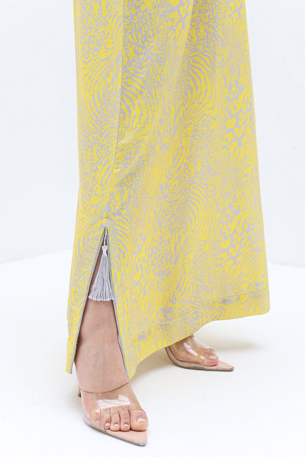 Yellow Abstract Linen Blend Jalabiya hem detail showing the side slit and flowing full-length silhouette.